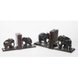 Two sets of ebony elephant bookends