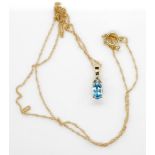Topaz and diamond 14ct gold pendant and chain