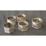 Five various sterling silver napkin rings