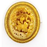 Antique Chinese carved ivory and gold brooch