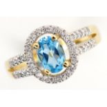 14ct yellow gold topaz and diamond halo ring