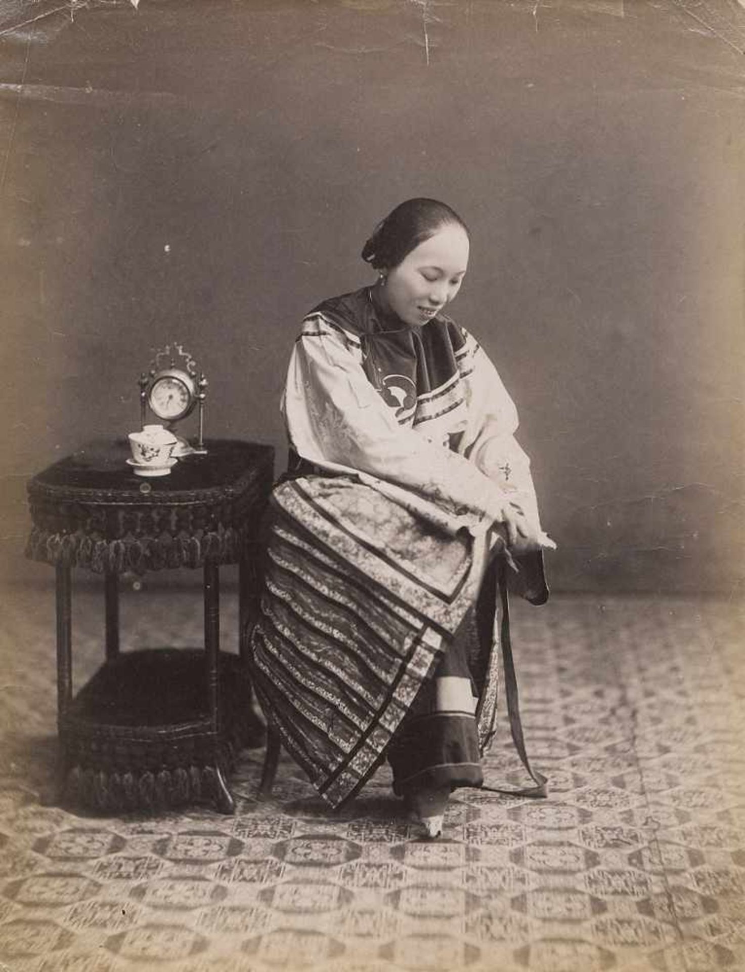 China: Chinese woman with bound feetPhotographer: Lai Afong (c. 1859 - 1941, attributed to). Chinese