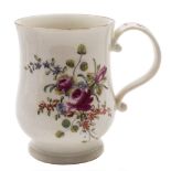 A Derby bell-shaped mug: with scroll handle painted in 'cotton stem' style with floral sprays and