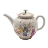 A Lowestoft teapot and cover: of globular form with flower finial,