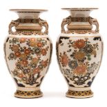 A pair of Japanese Satsuma vases: of baluster form with mythical beast mask handles,