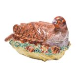 A Derby partridge tureen and cover: the bird with brown and puce plumage and seated on it's nest,