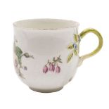A Chelsea bell-shaped coffee cup: with twig handle and applied forget-me-not flowers and leaves,