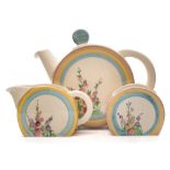 A Clarice Cliff three-piece tea service in the Hollyhocks pattern: of Bonjour shape each painted