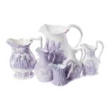 Six Samuel Alcock lavender and white relief moulded jugs: comprising The Battle of Acre,