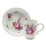 A Longton Hall coffee cup and saucer: painted in 'Trembly Rose' style with floral sprays and sprigs,