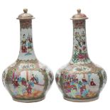 A pair of Canton famille rose bottle-shaped vases and covers: painted with panels of numerous
