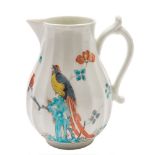 A First Period Worcester milk jug: of fluted form with sparrow beak spout and scroll handle,