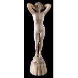 An early 20th century carved ivory figure: of a standing female nude,