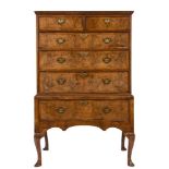 An early 18th Century walnut and cross and feather banded chest on stand:,