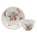 A Chelsea teabowl and saucer: painted with floral sprays and sprigs,