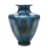 A Loetz Phanomen glass vase: of twelve lobed form with waisted neck and flared rim,