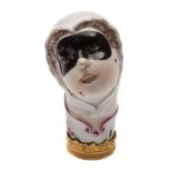 A Chelsea cane handle or etui cover: in the form of the head of Columbine with brown hair,
