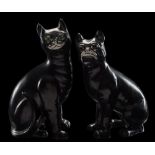 A Galle-style pottery cat and matching pug: each modelled in seated posture under black glazes and