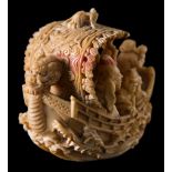 A Japanese carved ivory okimono of the seven lucky Immortals on their treasure ship: with dragon's