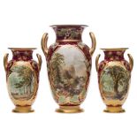 A composed garniture of three Samuel Alcock porcelain 'named view' vases: of ovoid form with loop