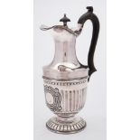 An Edward VII silver hot water jug, maker William Aitken, Birmingham, 1903: with domed hinged lid,