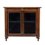 A Regency rosewood and gilt metal mounted dwarf display cabinet: with a satinwood crossbanded top,