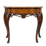 An 18th Century and later Italian walnut and marquetry side table:, of serpentine outline,