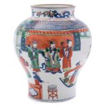 A Chinese Wucai baluster jar: painted with an official and two attendants being entertained by lady