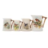 Four graduated Royal Worcester jugs painted by William Powell: of tapering barrel shaped form with