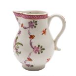 A Lowestoft sparrow beak jug: painted in 'Curtis' style with a ribbon tied bouquet within a floral