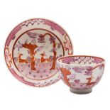 A Lowestoft tea bowl and saucer: painted in pink,