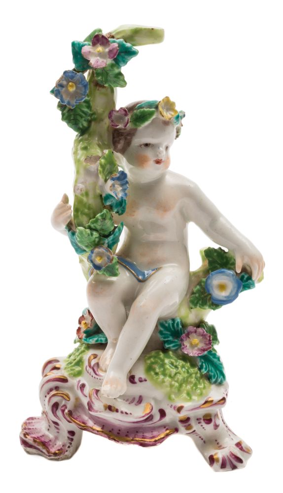 A Bow putto: seated with one arm around a branch, on pink and gilt rococo raised base, circa 1760,