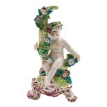 A Bow putto: seated with one arm around a branch, on pink and gilt rococo raised base, circa 1760,