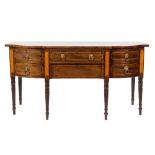 Of Royal Interest - A Regency mahogany and satinwood inlaid sideboard:, of bowed breakfront outline,