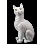 A Galle-style pottery cat: in the white, modelled in seated posture with inset glass eyes,