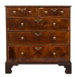 An early 18th Century walnut and oak diagonally crossbanded chest:,