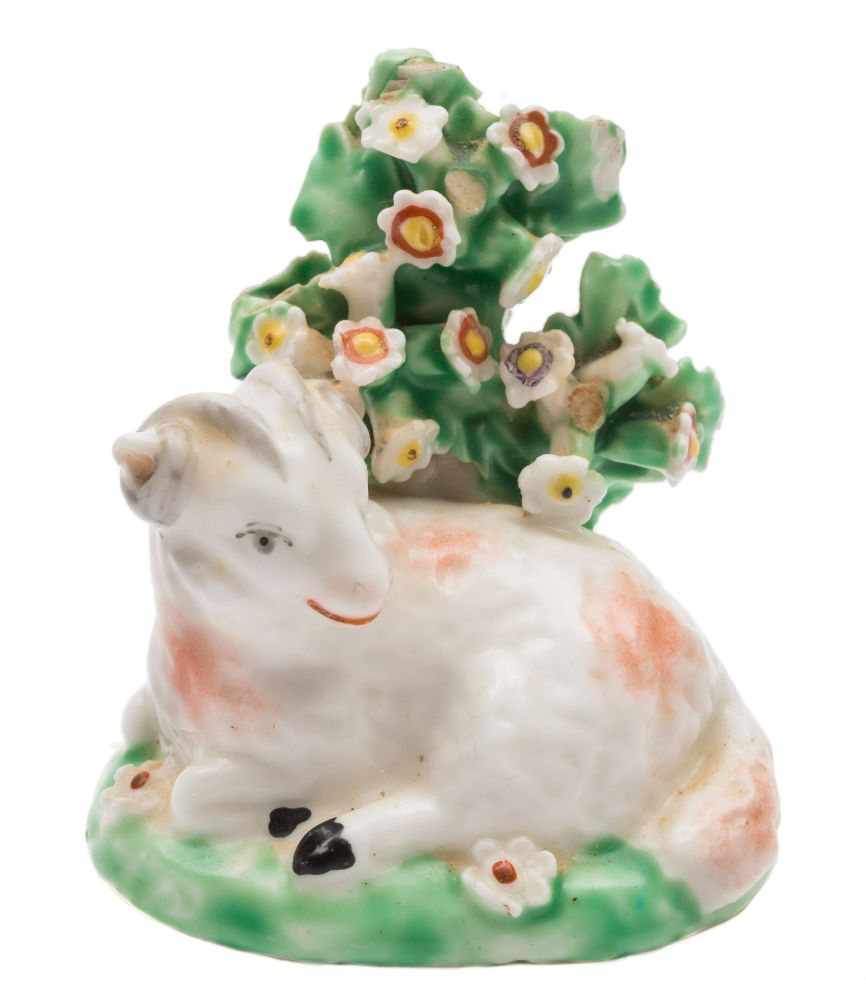 A Derby model of a recumbent ram: on mound base with bocage background, circa 1765-70,