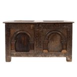 A 17th Century oak rectangular coffer:, with a plain twin moulded panel hinged top,