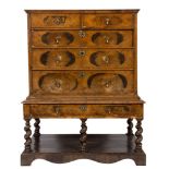 A late 17th Century walnut and cross and feather banded chest on later stand:,