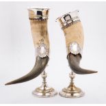 A pair of WMF silver plated horn vases: the cow horns with plated flared mounts,