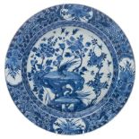 A Chinese blue and white dish: painted with pierced rockwork, birds, insects, flowers and foliage,