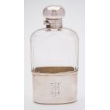 A George VI clear glass and silver mounted hip flask, maker Mappin & Webb, London, 1912: initialled,