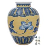 A Chinese underglaze blue and yellow-ground jar: of ovoid form with short waisted neck and rolled