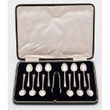 A set of twelve George VI silver teaspoons and tongs, maker Cooper Brothers & Sons Ltd, Sheffield,