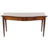 An early 19th Century mahogany serpentine fronted serving table:, with serpentine sides,