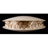 An early 20th century Japanese carved ivory okimono of the clam's dream: partially open to reveal a