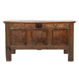 An early 18th Century oak rectangular coffer:, with a plain hinged moulded top,