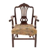 A George III mahogany elbow chair:, in the Hepplewhite taste,