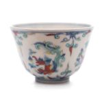 A small Chinese Doucai cup: painted with four dragon medallions between sprays of scrolling foliage,