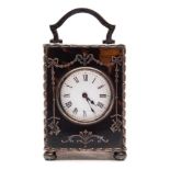 An Edwardian miniature tortoiseshell and silver carriage clock: the eight-day duration timepiece